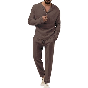 Detail of men's brown linen blend texture with Henley neck and drawstring waistband