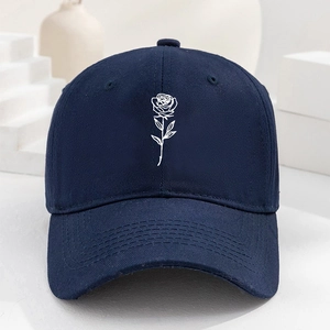 Navy blue cotton baseball cap with white rose embroidery and a curved brim