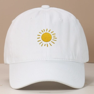 White baseball cap with yellow sun embroidery and washed vintage cotton finish