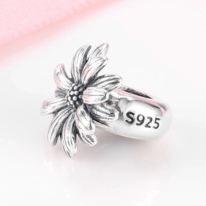 S925 sterling silver daisy spacer bead with floral details and silver hallmark