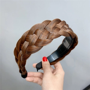 Close-up of brown fishtail braided headband with realistic synthetic hair texture