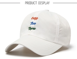 Close-up of three-color letter embroidery and breathable laser-cut mesh on white cap