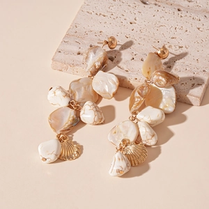 Bohemian style gold shell earrings with irregular marbled beads and white sea accents