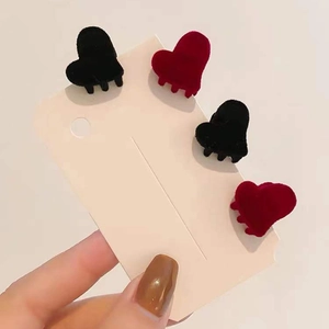 Mini heart-shaped velvet hair claws in red and black colors for kids and women