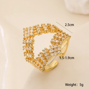 Macro shot of gold plated copper ring with cubic zirconia stones showing 2.5cm diameter size