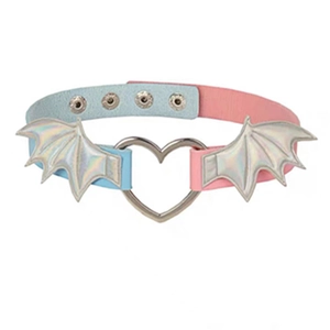 Detail of blue and pink PU leather choker with metal heart and bat wings wings ornament