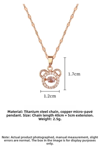 Macro view of rose gold bear necklace with sparkling zircon pavé and dancing stone