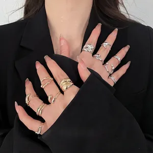 Modern gold and silver resin pleated ring set with rhinestones for a layered jewelry look
