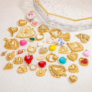 Golden heart-shaped enamel pendants with zircon inlay and various colorful patterns