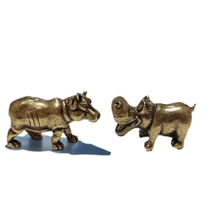 Solid brass hippo figurines with vintage finish, including standing and laughing poses