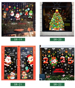 Detail of Christmas window clings showing Santa and reindeer designs for 2025 holiday decor