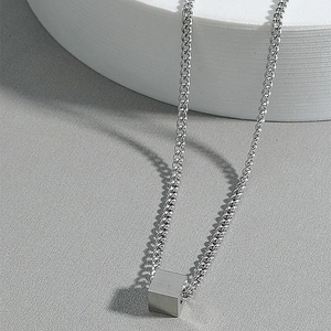 Minimalist silver cube pendant necklace in polished titanium steel for men and women