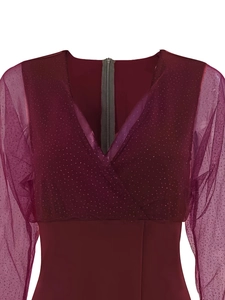 Detail of burgundy V-neck dress featuring mesh sleeves and shimmering sequin accents