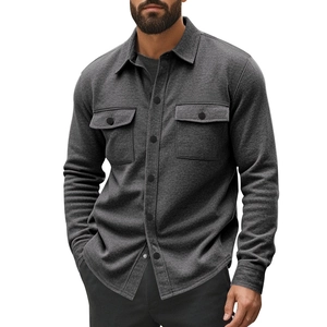 Close-up of textured dark grey fleece jacket with double chest pockets and lapel