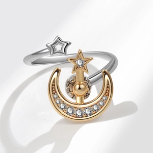 Star and moon spinner ring with silver open band and gold plated zircon crescents
