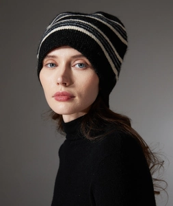 Detailed knit texture and black gray white stripe pattern on warm wool winter hat