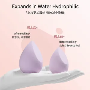 Purple teardrop makeup sponges showing wet and dry sizes on a palm, soft and bouncy texture