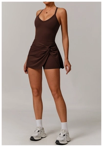 Detailed view of the twisted knot skirt design on this brown athletic tennis dress