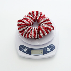 Detailed view of striped red and silver scrunchie on scale weighing 7.5 grams
