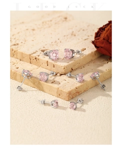 Macro shot of S925 sterling silver stamp and pink firework-cut cubic zirconia earring