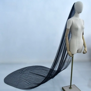 Detailed view of lightweight black bridal veil in long floor-length tulle for creative weddings