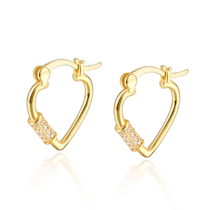 Macro shot of gold heart hoop earrings with pavé cubic zirconia and mirror reflection