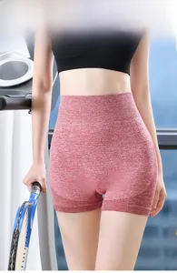 Close-up of high-waisted seamless heather red yoga shorts with elastic fit for fitness