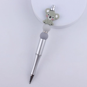 Detail of silver beaded pen featuring a grey silicone koala charm and colorful accents
