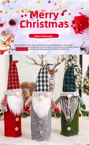 Close-up of three plaid Christmas gnome wine bottle covers with faux fur beards and buttons