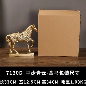 Golden resin horse statue with hollow design and rhinestone details next to shipping box