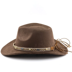 Detail of bohemian dark brown cowboy hat with ethnic beaded band and suede texture