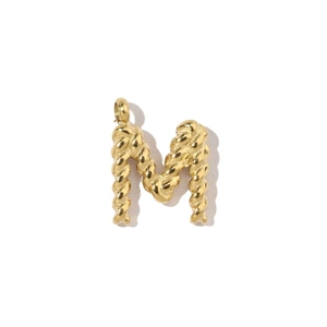 Detail shot of golden letter M pendant with unique twisted rope texture design