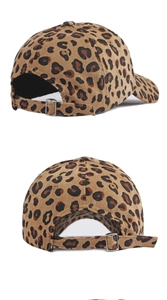 Detail of leopard print corduroy baseball cap showing the metal buckle and back strap