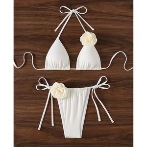 White two-piece bikini set with stylish 3D floral roses on straps and side-tie bottoms