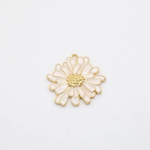 Detailed macro view of pink enamel daisy flower pendant charm with gold alloy edges
