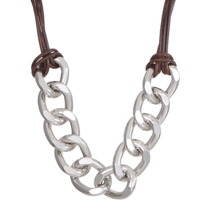 Detailed view of silver thick chain necklace with brown braided wax cord and polished rings