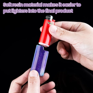Detailed view of hand inserting a lighter into a purple glitter resin protective case