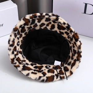 Detail view of leopard print bucket hat showing thick faux fur texture and adjustable inner drawstring