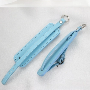Detail of sky blue PU leather keychain strap with white stitching and silver metal ring