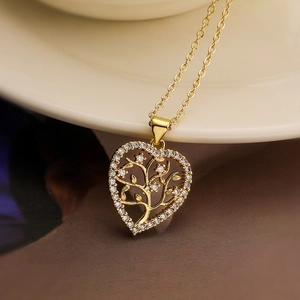 Elegant gold heart pendant necklace featuring a tree of life design with sparkling zircons