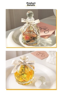 Detail of vintage glass diffuser bottle with dried rose and orange slices for home decor