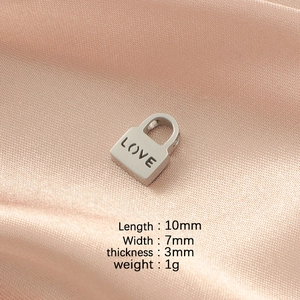 Macro shot of 10x7mm stainless steel Love lock pendant showing dimensions and polished finish