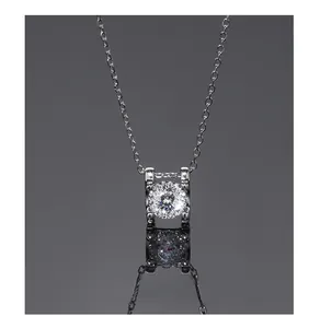 Close-up of geometric S925 silver necklace with sparkling round zircon in a four-claw setting