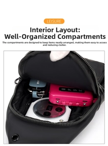Internal view of the black crossbody bag showing organized space for phone and power bank