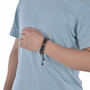 Detailed close-up of 8mm matte volcanic stone and tiger eye beaded bracelet for men