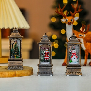 Close-up of vintage bronze Christmas lanterns with Santa and snowman miniature scenes