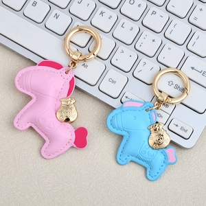Cute PU leather horse keychains in pink and blue with gold money bag charms and spring rings