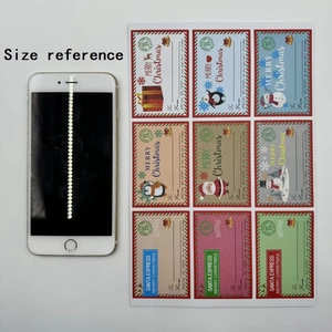 Size reference of 3x2 inch Christmas gift labels next to a white smartphone for scale