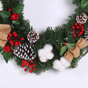 Linen and cotton Christmas wreath with pine needles, red berries and cotton flower decoration