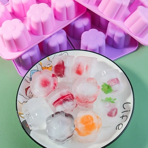 Close-up of fruit-filled flower-shaped ice cubes made with flexible silicone mold